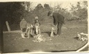 Oscar-James-with-his-son-Phil-and-daughter-Joan-skinning-rabbits-c-1929