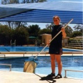 Bianca cleaning the pool